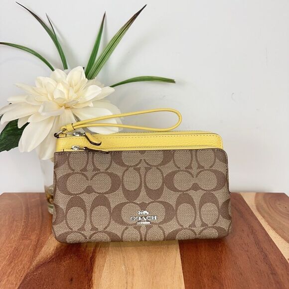 Coach Handbags - NWT Coach Double Zip Wallet In Signature Canvas